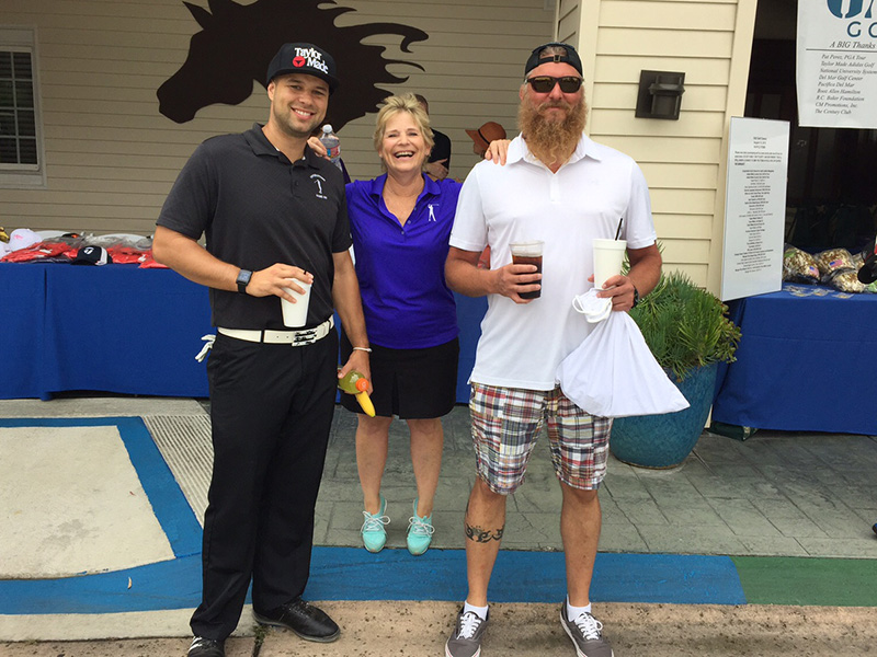 CHTCS’ Lt. Cpl. John Wiley with OGO Founder Tony Perez’s wife, Susan Perez, and OGO member