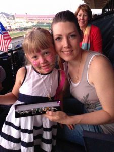 Military wife and her daughter holding the “Purple Heart” bracelet